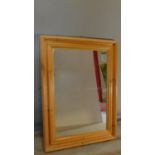 A large pine framed mirror. 92x65cm