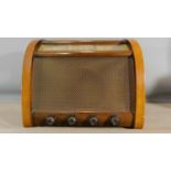 A vintage GEC walnut cased radio in working order. H.38 W.46 D.25cm