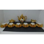 A continental gilt and transfer decorated coffee set