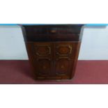 A Georgian mahogany and inlaid corner cupboard H.124 W.107 D.57cm