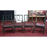 A set of four green painted wicker armchairs with sloped arms, H.99 W.52 D.53cm