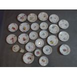 A collection of Meissen porcelain to include 23 plates, a cup and a sugar pot