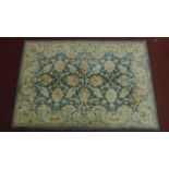A large woollen floral design carpet. 245x168cm (wear to one edge)