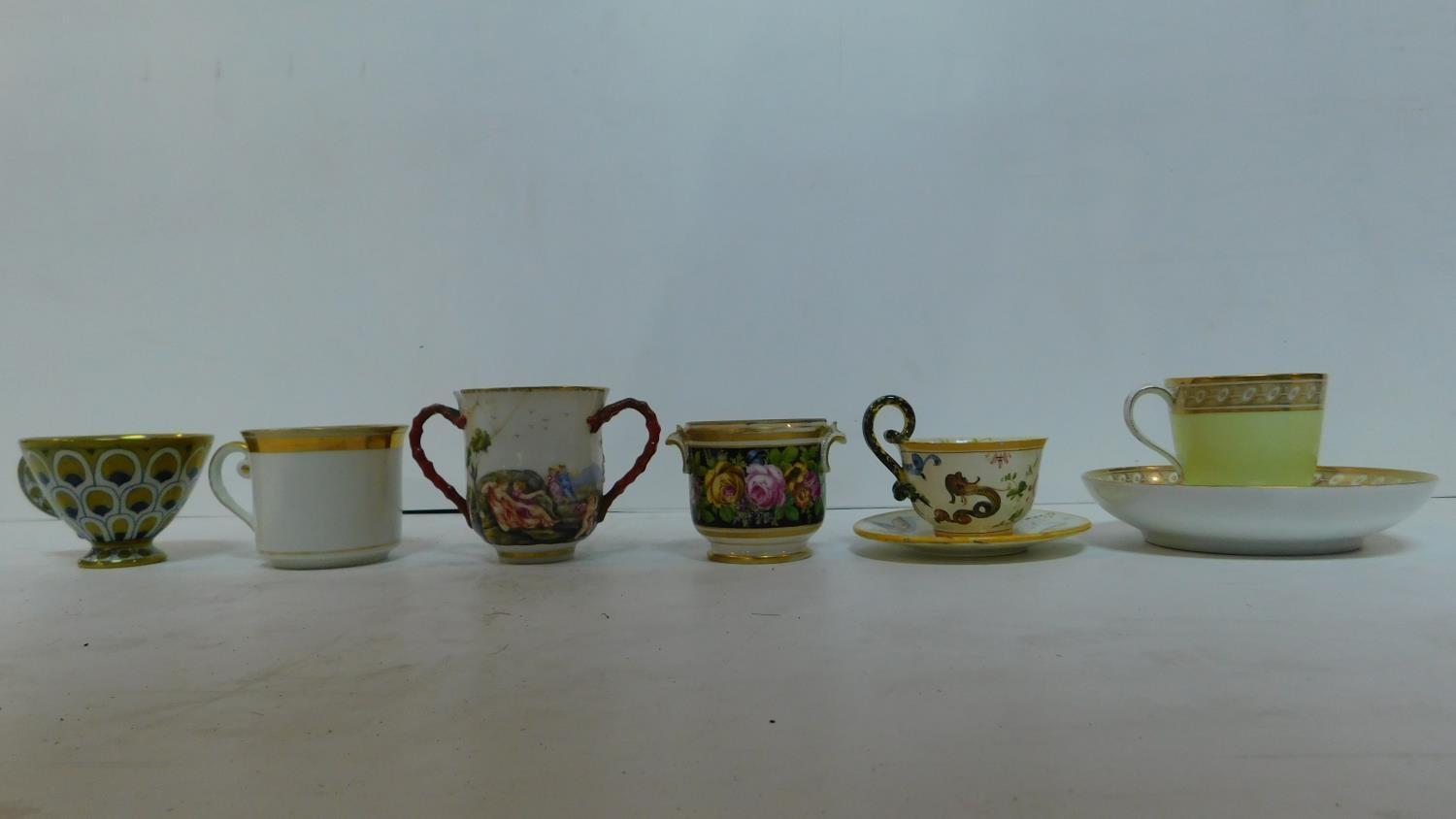 A miscellaneous collection of porcelain cups, some with saucers, mostly 19th century continental (6)