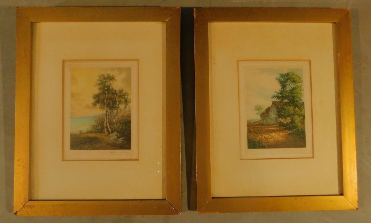 A pair of framed and glazed signed etchings, landscapes. H.37 W.29cm