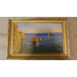 A gilt framed oil on canvas, cliffs by the sea with sailing boat, signed M. Sablic. 60x40cm
