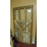 A large farmhouse style stained pine door with 3 glass panels, 210 x 114cm