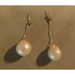 A pair of large natural pearl drop earrings. (one drop slightly shorter with missing clip) D.1.4cm
