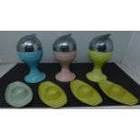 A set of 4 1970's German melamine egg cups and 3 vintage metal and chrome pouring vessels. H.19 W.9