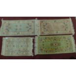 4 Chinese style rugs all with central floral medallions on a pastel field, framed with floral