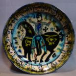 A Persian glazed ceramic bowl, decorated with a figure on horseback, date and mark to base, H.7cm