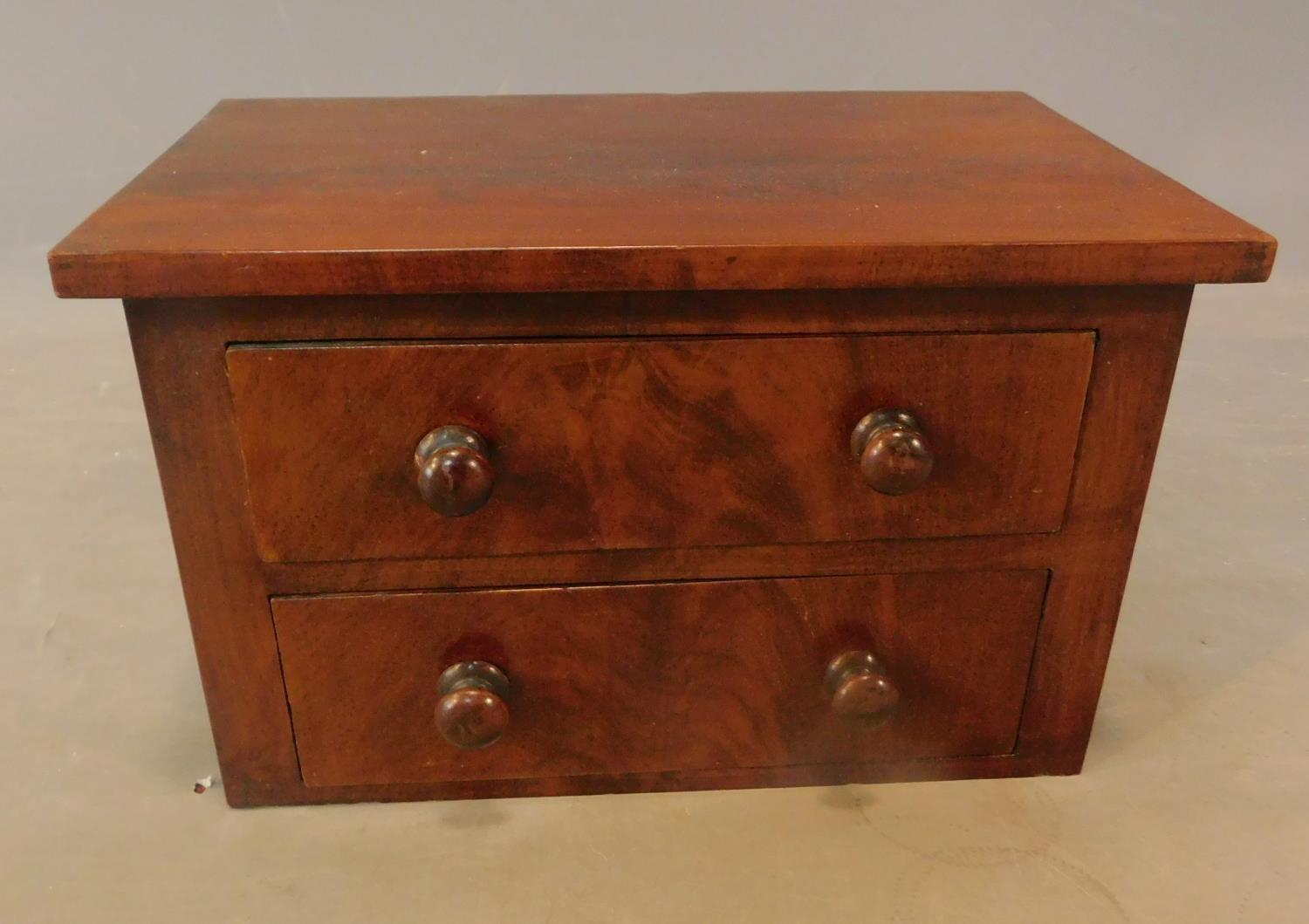 A Victorian mahogany miniature chest. H.19 W.30 D.19cm