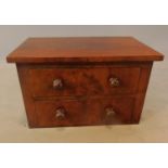 A Victorian mahogany miniature chest. H.19 W.30 D.19cm