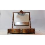 A Regency flame mahogany swing mirror, fitted drawers to base. H.63 W.63