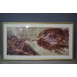 A framed and glazed print of Michelangelo's The Creation of Adam, 44 x 80cm