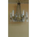 A gilt metal and crystal 6 branch chandelier. 70x65cm
