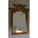 A contemporary Empire style pier mirror with swag decoration. 121x88cm