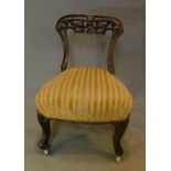 A Victorian carved mahogany bedroom chair. H.70cm