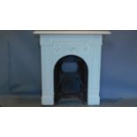 An Edwardian cast iron fire surround with mantle and grate. H.100 W.95cm