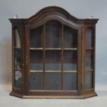 A 20th century Dutch walnut display cabinet, with moulded cornice above astragal glazed door, H.68