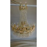 A gilt metal and crystal chandelier of basket form. (all crystals present, some detached) 65x44cm.