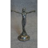 A chromium Art Deco figure of a standing lady. H.32 W.22cm