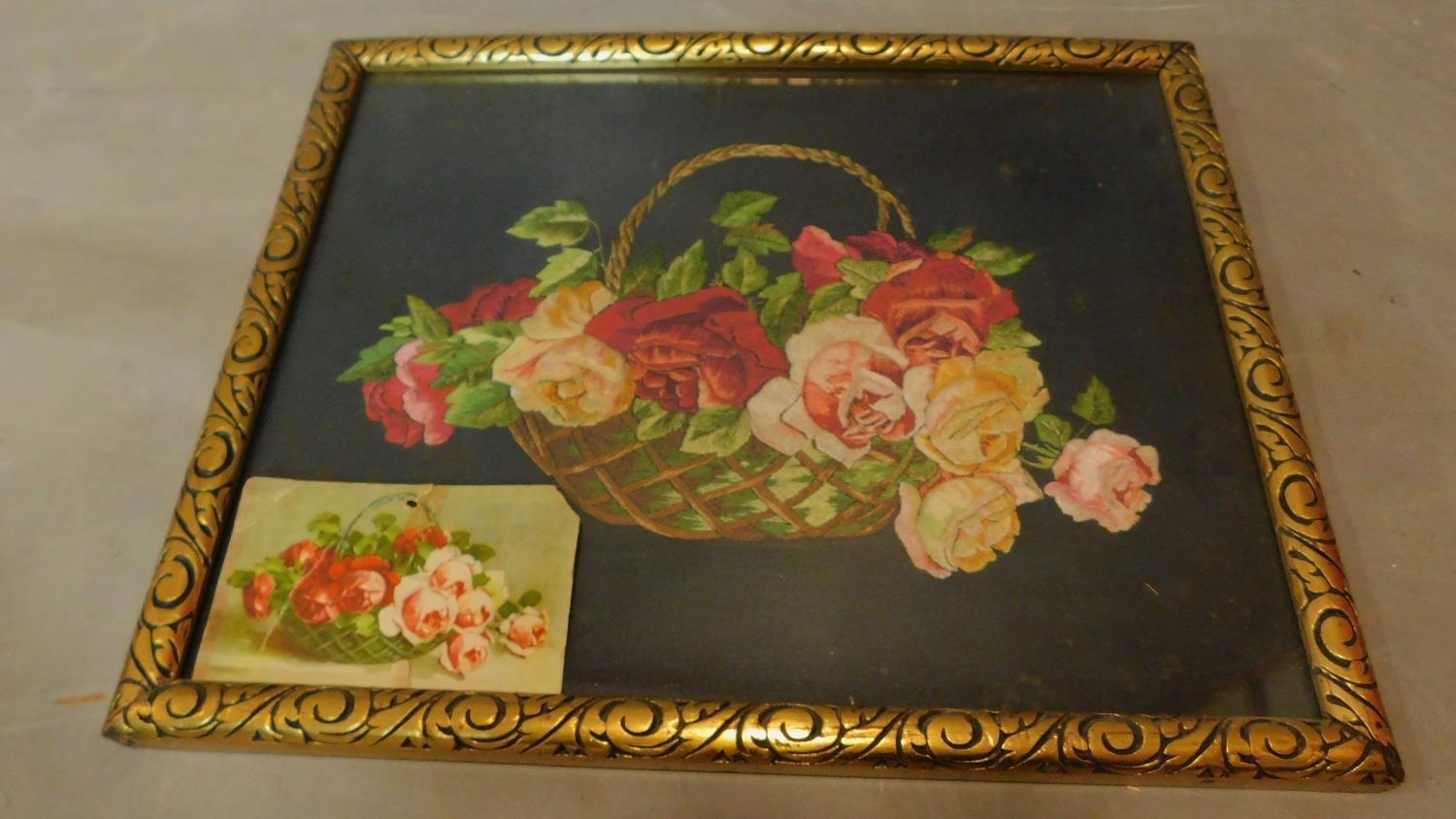 A framed and glazed tapestry depicting flowers in a bowl. 33x42cm