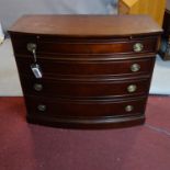 A Regency style mahogany bow fronted chest of four drawers, with brush slide, H.92 W.112 D.51cm