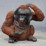 A fibreglass model of an Orangutan, H.38 W.46 D.30cm