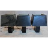 Three matching table lamps with black shades and bases. 18x15cm