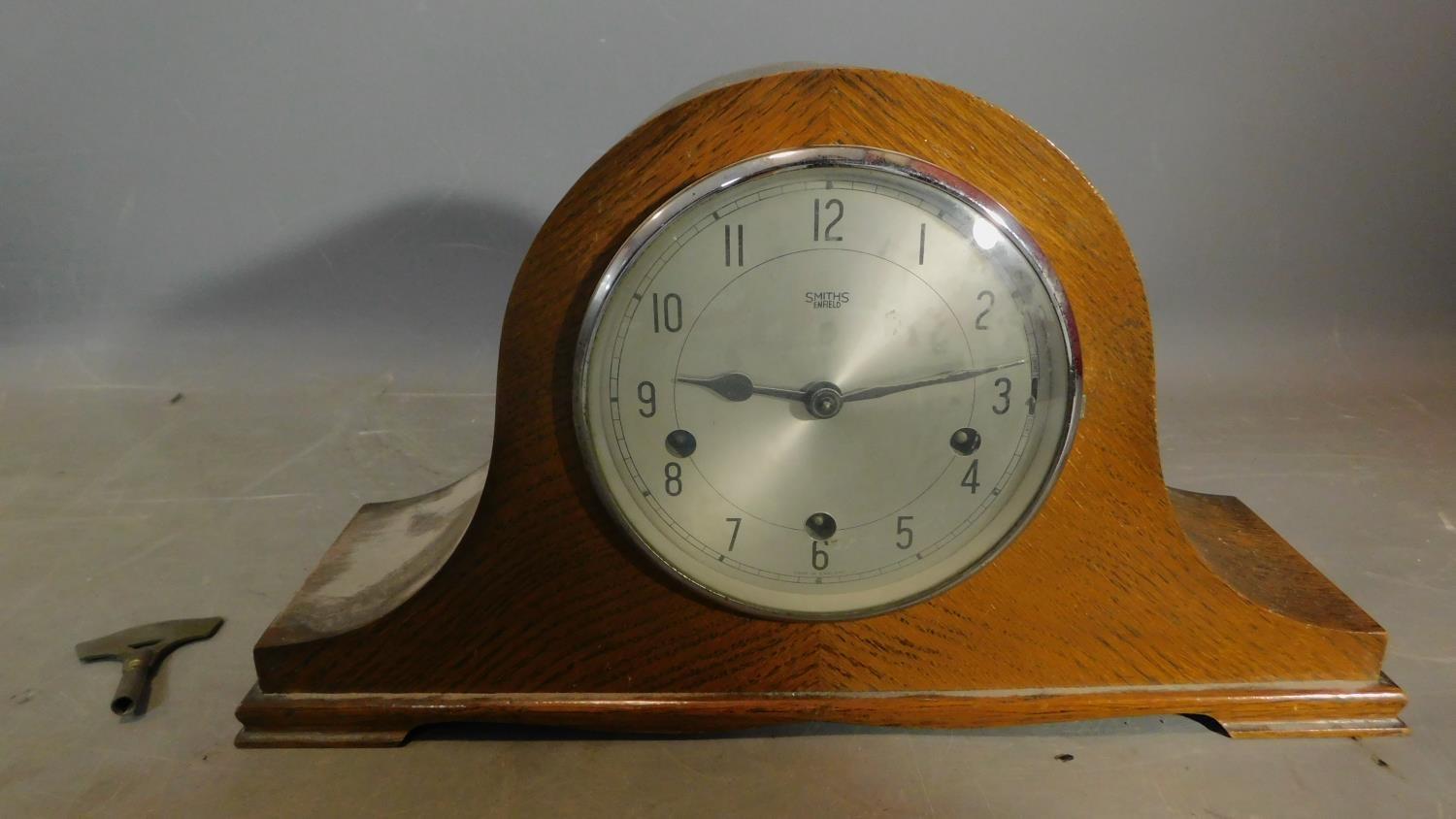 An oak cased Smiths Enfield mantel clock. H.43 W.23 D.12cm