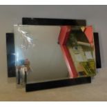 An Art Deco style wall mirror. H.50 W.70cm