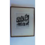 A framed and glazed etching, Norwich street. signed H. J. Starling. 46x38cm.
