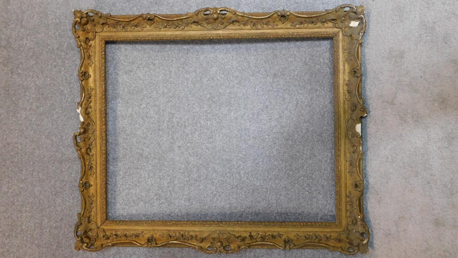 A large 19th century vacant gilt wood and gesso picture frame, 116 x 94cm - outer, 92 x 74cm - inner