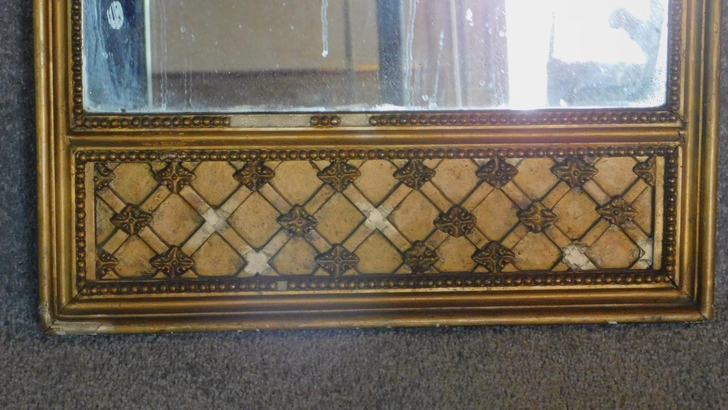 A tall Victorian gilt wood pier mirror, with carved ribbon crest and beaded border, having silk - Image 2 of 4