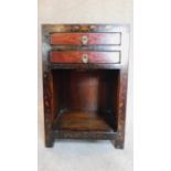 A small Chinese laquered cabinet fitted drawers to frieze. H.60 W.40 D.33cm