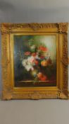 A large oil on canvas in ornate gilt frame, still life flowers, signed Charles Tucker. 74x84cm