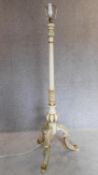 A painted French style standard lamp on tripod cabriole supports. H.160cm