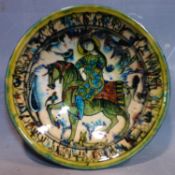 A Persian glazed ceramic bowl, decorated with a lady on horseback, dated and marked to base, H.6.5cm