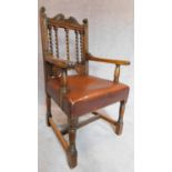 A late Victorian oak throne desk chair with tan leather upholstered seat. 111x60x56cm
