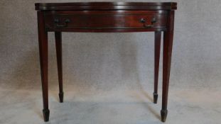 A Regency style mahogany flap top tea table. H.80 W.90 D.41cm