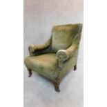 An Edwardian mahogany framed armchair in olive green upholstery. 92x70x74cm
