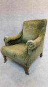 An Edwardian mahogany framed armchair in olive green upholstery. 92x70x74cm