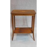 An Edwardian mahogany and satinwood inlaid 2 tier occasional table. 70x56x37cm