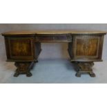 A 1930's German carved oak desk fitted drawers and cupboards. H.76 W.174 D.82cm