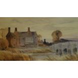 A framed and glazed watercolour of houses by a lake, signed H. G. Hine. 33x42cm