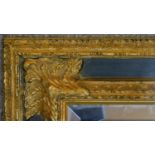 An ornate rococo style gilt framed mirror. H.78 W.67cm