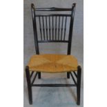 A late Victorian spindle back rush seated bedroom chair. H.80 W.44 D.41cm