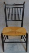 A late Victorian spindle back rush seated bedroom chair. H.80 W.44 D.41cm