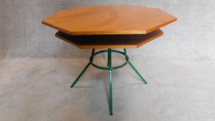 A mid 20th century teak octagonal topped two tier centre table on a green metal frame. H.70 W.92cm